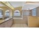 Spacious bathroom features double sinks, walk-in shower, and garden tub at 6121 Piedmont Dr, Spring Hill, FL 34606