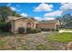 Charming home exterior showcasing curb appeal with well-maintained landscaping at 6121 Piedmont Dr, Spring Hill, FL 34606