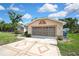 Home featuring a two-car garage and decorative driveway at 6121 Piedmont Dr, Spring Hill, FL 34606
