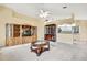 Spacious living room featuring built-in shelving at 6121 Piedmont Dr, Spring Hill, FL 34606