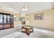 Open-concept living room with dining area and kitchen in the background at 6121 Piedmont Dr, Spring Hill, FL 34606