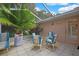Outdoor patio with tiled floor, outdoor furniture and a well lit, screened-in area at 6121 Piedmont Dr, Spring Hill, FL 34606