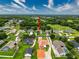 Expansive aerial view of a suburban neighborhood with well-manicured lawns and mature trees at 6204 Rockross Ave, New Port Richey, FL 34655