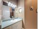 Bathroom with tiled floors and a white vanity with lots of lighting at 6204 Rockross Ave, New Port Richey, FL 34655
