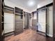 Walk-in closet with built-in shelving and drawers for ample storage space at 6204 Rockross Ave, New Port Richey, FL 34655