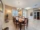 The dining room has a chandelier, neutral colors, and is conveniently located near the foyer and kitchen at 6204 Rockross Ave, New Port Richey, FL 34655