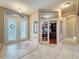 The foyer features decorative tile flooring, double-glass doors, and access to the office and dining room at 6204 Rockross Ave, New Port Richey, FL 34655
