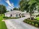 Beautiful home with mature landscaping, a spacious driveway, and a well-maintained lawn, offering great curb appeal at 6204 Rockross Ave, New Port Richey, FL 34655