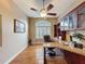 Dedicated home office space includes built-in shelving, an exterior window, and wood flooring at 6204 Rockross Ave, New Port Richey, FL 34655