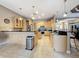 Well-equipped kitchen offers black countertops, custom wood cabinets, stainless appliances, and a functional layout at 6204 Rockross Ave, New Port Richey, FL 34655