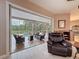 The living room seamlessly connects to the screened pool area, offering great indoor-outdoor living at 6204 Rockross Ave, New Port Richey, FL 34655