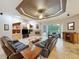 The spacious living room features a fireplace and sliding glass doors opening to a screened outdoor area at 6204 Rockross Ave, New Port Richey, FL 34655