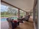 Inviting screened patio with comfortable seating, a pool, and a relaxing spa for outdoor enjoyment at 6204 Rockross Ave, New Port Richey, FL 34655