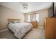 Bedroom with wood-look floors, a neutral paint, and a ceiling fan at 6503 Santiago Ct, Apollo Beach, FL 33572