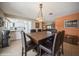 Dining room featuring a decorative chandelier and access to the kitchen and living room at 6503 Santiago Ct, Apollo Beach, FL 33572