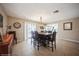 Bright dining room featuring tile flooring and views to the screened-in patio and pool at 6503 Santiago Ct, Apollo Beach, FL 33572