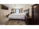 Comfortable main bedroom featuring neutral paint, a ceiling fan, and access to the screened-in patio at 6503 Santiago Ct, Apollo Beach, FL 33572