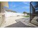 A large patio is adjacent to the screened enclosure at 6503 Santiago Ct, Apollo Beach, FL 33572
