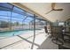 Inviting screened-in pool area with covered patio, ideal for outdoor relaxation and entertainment at 6503 Santiago Ct, Apollo Beach, FL 33572