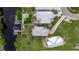 A beautiful aerial view of a house with a dock and two boats sitting on a river at 6512 Simone Shores Cir, Apollo Beach, FL 33572