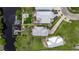 A beautiful aerial view of a house with a dock and two boats sitting on a river at 6512 Simone Shores Cir, Apollo Beach, FL 33572