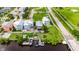 An aerial view highlighting waterfront homes with docks, lush green lawns and a quaint neighborhood street at 6512 Simone Shores Cir, Apollo Beach, FL 33572