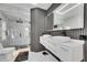 Bathroom featuring a glass enclosed shower, dual vessel sinks, and modern fixtures at 6512 Simone Shores Cir, Apollo Beach, FL 33572