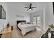 Bright bedroom with a ceiling fan, decor, and access to an outdoor balcony at 6512 Simone Shores Cir, Apollo Beach, FL 33572