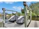 Boat dock features two covered boat slips with lifts for easy access to the water at 6512 Simone Shores Cir, Apollo Beach, FL 33572