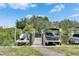 Dock featuring boats, jet skis, and gated entry with a waterfront view at 6512 Simone Shores Cir, Apollo Beach, FL 33572