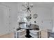 Dining area with modern chandelier, with an open view of the kitchen and adjacent living area at 6512 Simone Shores Cir, Apollo Beach, FL 33572
