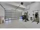 Spacious garage area features exercise equipment at 6512 Simone Shores Cir, Apollo Beach, FL 33572