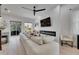Living room with an electric fireplace, shiplap wall, and sliding glass doors to the outside at 6512 Simone Shores Cir, Apollo Beach, FL 33572