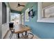 Inviting outdoor space with a ceiling fan, television and canal views at 6512 Simone Shores Cir, Apollo Beach, FL 33572