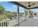 A porch with views of the water and a ceiling fan at 6512 Simone Shores Cir, Apollo Beach, FL 33572