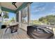 Cozy screened-in porch featuring an outdoor dining set at 6512 Simone Shores Cir, Apollo Beach, FL 33572