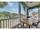 Relaxing covered patio with a wooden table and marina views at 6512 Simone Shores Cir, Apollo Beach, FL 33572