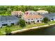 Aerial view of back of home and community with lush landscaping and lake views at 6711 Rocky Park St, Tampa, FL 33625