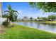 Beautiful backyard view featuring the pond and other homes in the community at 6711 Rocky Park St, Tampa, FL 33625
