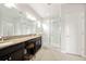 Bathroom features double sinks, granite counters, and glass enclosed shower at 6711 Rocky Park St, Tampa, FL 33625