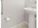 Close up of a pedestal sink and grab bar in a bathroom at 6711 Rocky Park St, Tampa, FL 33625