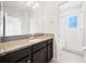 Bathroom boasts granite counters, large mirror, and glass enclosed shower at 6711 Rocky Park St, Tampa, FL 33625
