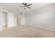 Spacious bedroom features neutral carpet and multiple doorways to other rooms at 6711 Rocky Park St, Tampa, FL 33625