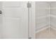 Walk-in pantry with white wire shelving units for optimal kitchen storage and organization at 6711 Rocky Park St, Tampa, FL 33625