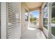 Enclosed patio with lake view, offering a serene outdoor living space at 6711 Rocky Park St, Tampa, FL 33625