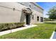 Back of the townhome with screened door and a view of the community pond at 6711 Rocky Park St, Tampa, FL 33625