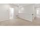 Cozy upstairs landing area with neutral carpet and access to bathroom at 6711 Rocky Park St, Tampa, FL 33625