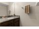 Granite countertop and dark wood cabinets offer modern touch to this cozy bathroom at 7001 Interbay Blvd # 242, Tampa, FL 33616