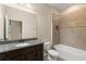 Bathroom with granite countertops, single sink and tiled tub and shower at 7001 Interbay Blvd # 242, Tampa, FL 33616