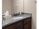 Modern bathroom vanity with granite countertop and decorative fixtures at 7001 Interbay Blvd # 242, Tampa, FL 33616